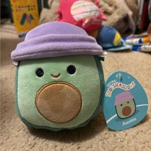 NWT Squishmallows avocado with a purple hat whose name is Austin